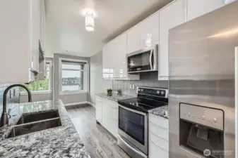 Kitchen; Quartz countertops and stainless appliances