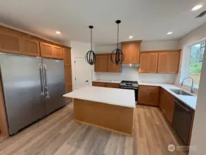 Custom built wood cabinets and HUGE side by side fridge freezer combo. Home as of 8/15/2025