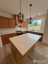 Spacious island with sink located in front of the window. Home as of 8/15/25