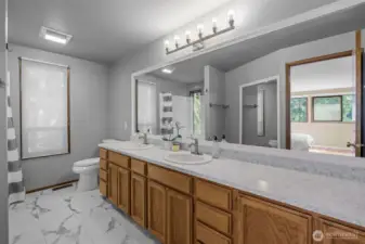 5 piece remodeled bathroom with new countertops, tub/shower surrounds and flooring.