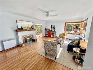 The spacious living room offers original oak floor, coved ceiling, arched doorways and beautiful Mahogany woodwork.