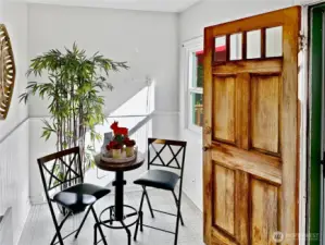 Sunny eating nook or cozy office space with access to the side sun deck and lower slate patio.