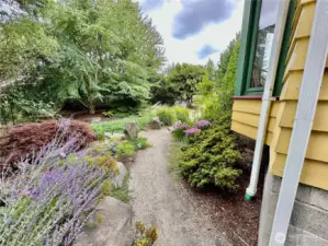 The gravel walkways with accent boulders winds through the grounds for your enjoyment.