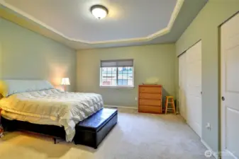 The primary bedroom boasts coved ceiling and double closets.