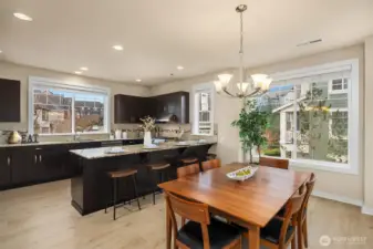 Expresso cabinets contrast beautifully with the white oak flooring. Large windows let the light pour in.