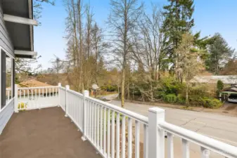 Balcony off the front deck looks onto Roosevelt Way NE and faces east. Enjoy morning sunrises with coffee or tea on the balcony.