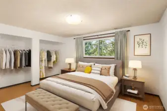 Primary bedroom on upstairs level. Window faces north. This room is staged virtually.