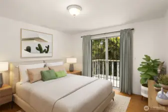 Second bedroom on upper level with entry to back upper deck. This photo is staged virtually.