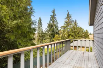 Back deck off 2nd upstairs bedroom faces west and overlooks backyard deck. This home is perched above the homes to the north as the hill slopes away and allows for plenty of privacy to the north.