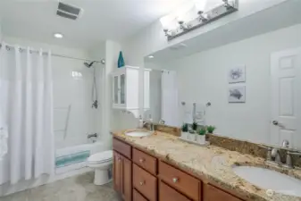 additional bathroom upstairs for 2 bedrooms and bonus room, double sinks with great location.