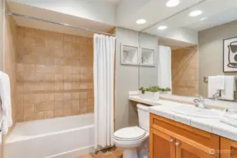 Large, tiled bathroom