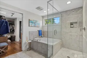 huge primary bath with soaking tub and oversized frameless shower