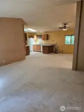 Living room with dining room and kitchen