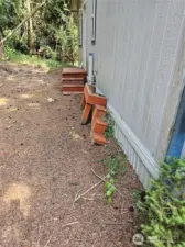 side with porch repair needed