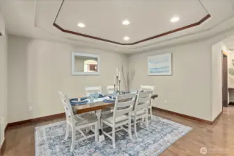 Stunning formal dining room featuring recessed lighting and a statement ceiling inlay for elevated gatherings.