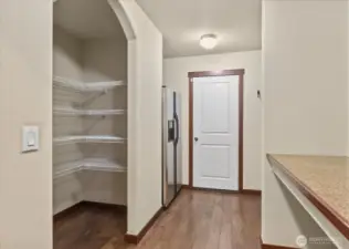 Walk-in Pantry & Additional Fridge. Even space to drop all  as you enter from the garage