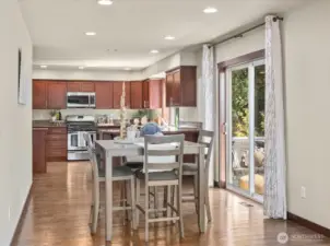 Casual Dining between the kitchen and main living space with backyard deck access.