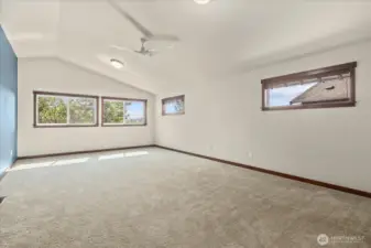 Whether movie nights or a home gym, this spacious flex room offers beautiful sunsets and natural privacy.