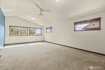 Whether movie nights or a home gym, this spacious flex room offers beautiful sunsets and natural privacy.