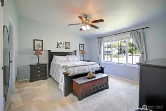 Primary Bedroom with vaulted ceilings & walk-in closet.