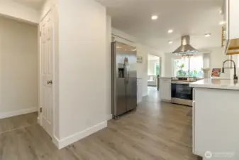 View from back door - Large pantry, gorgeous brand new kitchen with gleaming quartz countertops & stainless steel appliances