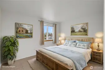 Bedroom #1- Fresh paint, new carpet, and updated white trim and doors.