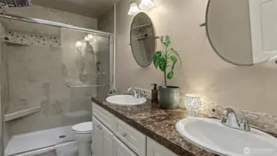 A welcoming upper level guest bath with beautiful tile and modern touches.