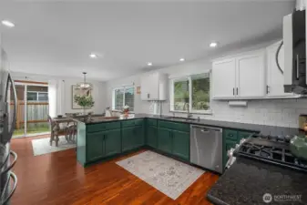 Kitchen looking back to the dining area, with slider access to side yard.