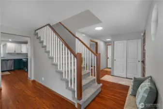 Stairway up to 4 bedrooms, 2 bathrooms and a large unfinished storage room above the living space.