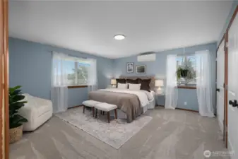 Bright and spacious primary bedroom with Ductless mini spit.