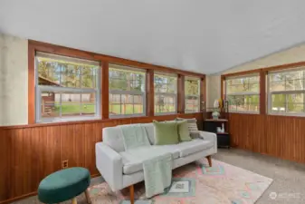 Sunroom/Den which leads you outside to the most gorgeous backyard Oasis.