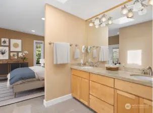 Dual vanities with beautiful granite countertop.