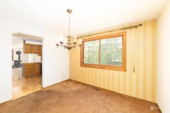Formal Dining room w/ lots of Natural Light which Overlooks the Monumental Back Yard.