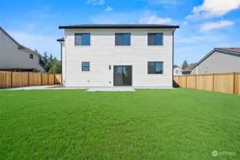 Large fenced backyard with patio area for entertaining.