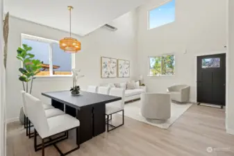 Formal front living room with dining area. Wood flooring throughout the home.