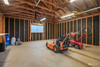 The well-built shed has power and offers plenty of space for yard equipment storage.