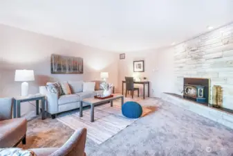 A gas fireplace keeps this room cozy. Small fossils can be found in the unique fireplace stone.