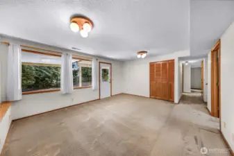 Alternate view of the lower bonus room highlights spacious dimensions, closet storage, and corridor access. Flexible design suits multiple lifestyle needs.