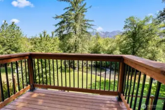Private deck off of primary bedroom with a view to creek.