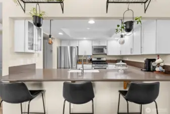 Breakfast bar and kitchen looking from dining area