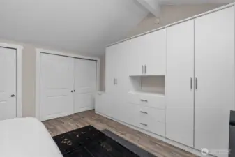 Primary bedroom - tons of closet space, wardrobe, and inside the walk-in closet is a doorway to added storage space