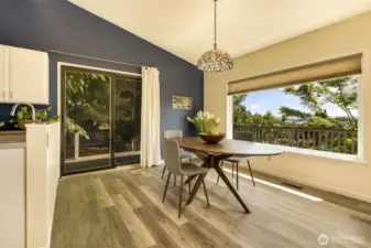 Dining room enjoys views and easy access to the deck and the kitchen.