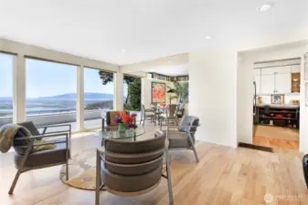 The living room flows seamlessly into the dinig room and kitchen.