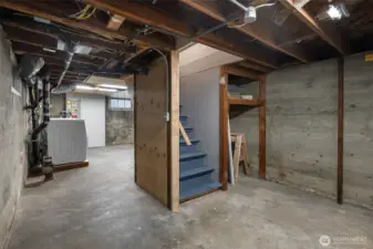 Basement with utility area.