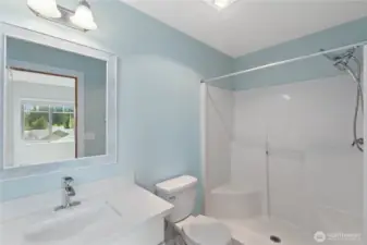 primary en-suite offers a sleek vanity and shower insert.