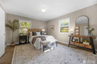 The primary bedroom is tucked away and is large enough to accommodate large furniture.