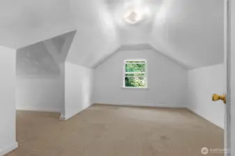 Upstairs showcases two bedrooms and a reading nook area.