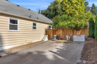 A parking space located at the backside of the home.