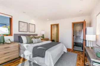 Primary bedroom with attached bath. This large room absolutely fits a king bed.