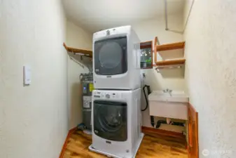 Large laundry room by bedrooms.